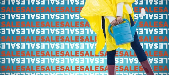 Poster - Composite image of woman in yellow raincoat holding an watering