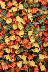  Trottole tricolour pasta forming an abstract background.