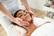 © javiindy - Woman receiving head massage in spa wellness center.