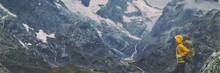 Mountain Hike Europe Travel Hiker Woman Trekking In Switzerland Alps Mountains Landscape Background. Panoramic Banner Of Hiker On Adventure Trek.