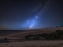 Vibrant Milky Way Composite Image Over Landscape Of English Countryside