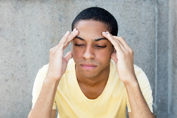 north african man with painful headache