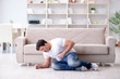 © Elnur - Sick man suffering at home from infection and bad stomach