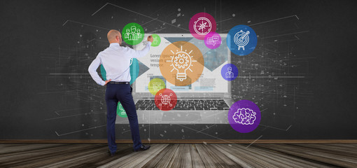Poster - Businessman in front of a Cloud of colorfull start up icon bubble with a laptop 3d rendering