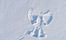 Snow Angel's Print On A Snowcovered Area. Aerial Foto.