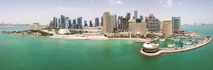 Wall Mural - The skyline of Doha, Qatar. Modern rich middle eastern city of skyscrapers, aerial view in good weather, view of marina, Gulf/Arabian Gulf