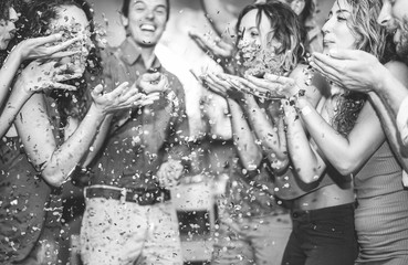 Wall Mural - Happy friends having fun throwing confetti at vintage cocktail bar party