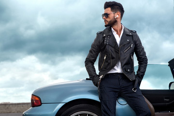 Handsome man near the car. Businessman.