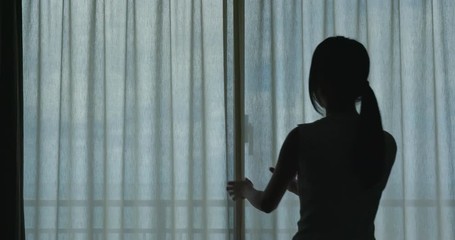 Poster - Woman open up curtain at the morning