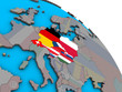 Central Europe with embedded national flags on simple blue political 3D globe.