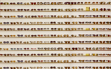 Showcase with different sun glasses in the store
