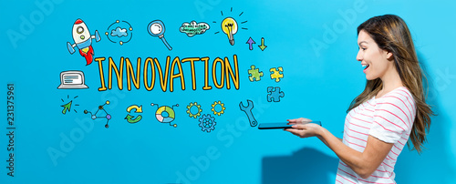 Innovation with young woman using her tablet Canvas Print