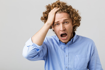 Poster - Portrait of a shocked young man wearing shirt