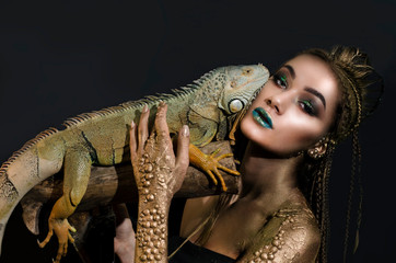 beautiful halloween girl and green iguana
