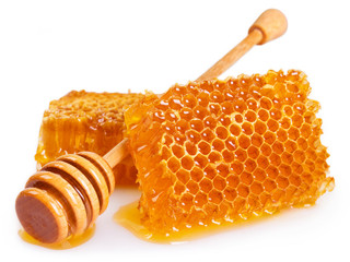 Wall Mural - Honey with honeycomb on white background