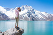 Girl looking at the amazing mountain views of the turquoise waters from the 