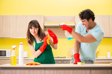 Young couple working at kitchen 