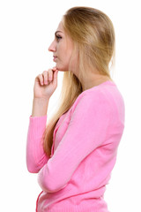 Wall Mural - Profile view of young beautiful teenage girl thinking