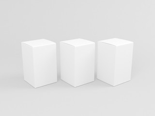 Wall Mural - Three White cardboard boxes mockup isolated on gray