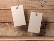 © customdesigner - Two Empty kraft paper tags label Mockup tied by rope on wooden box