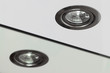 Recessed halogen lamp and reflection in the washbasin mirror.