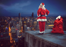 Santa Claus Looks Down On The City Waiting To Deliver The Presents