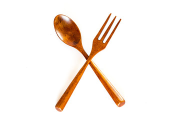 Wooden fork and spoon on white background