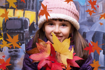 portrait of girl with leaves in autumn