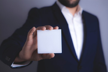 businessman holding a paper