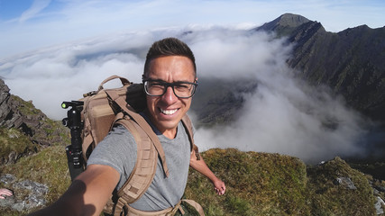 Wall Mural - The man on the top of Carrauntoohil makes a selfie