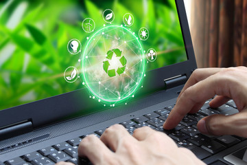 Hand use laptop computer with environment Icons over the Network connection