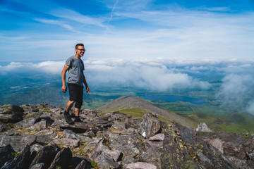 Wall Mural - Man on the trail to mount Carrauntoohil