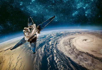 Wall Mural - space satellite monitoring from earth orbit weather from space, hurricane, typhoon on planet earth.