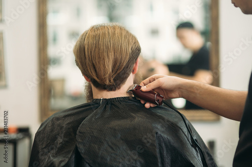 Bearded Man Having A Haircut With A Hair Clippers Back View Buy