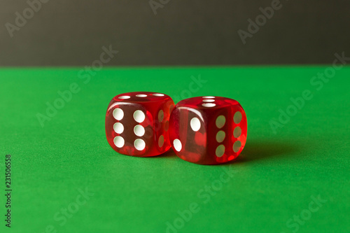 фотография Dice on a green background . Game concept. Games of chance