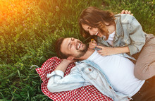 Laughing Couple On Green Meadow