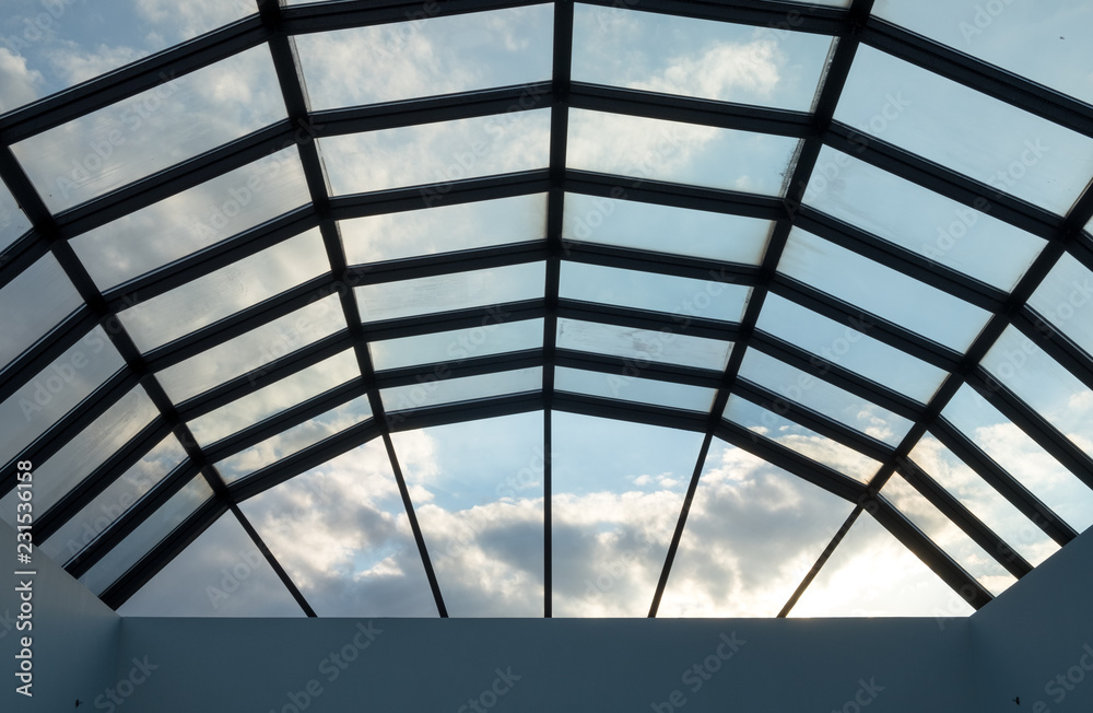 Modern glass roof with steel grid frames. Skylight rooftop window with ...