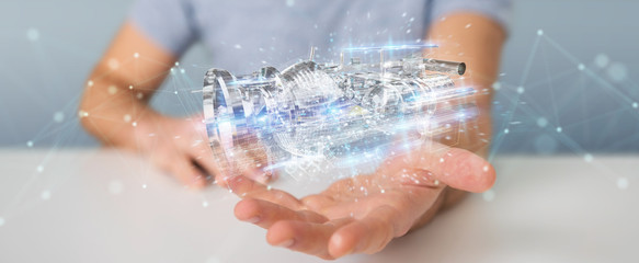 Poster - businessman using wireframe holographic 3d digital projection of an engine