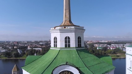 Wall Mural - Belfry of Trinity Cathedral, Pskov city, Russia, Europe. Pskov Kremlin and belfry of Trinity Cathedral church, aerial view. Panorama of city, cityscape. Embankment of Velikaya river. Bell tower