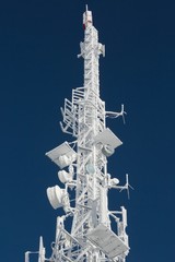 Wall Mural - Transmitter tower frozen in winter frost