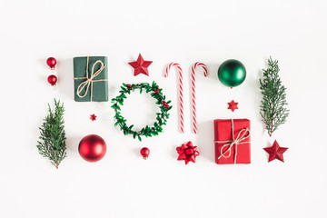 Christmas composition. Gifts, fir tree branches, red decorations on white background. Christmas, winter, new year concept. Flat lay, top view