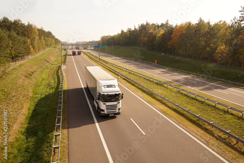 Fotomural Trucks while driving, in the background a traffic control system and electronic toll collection