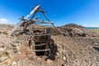 Old entrance of an abandoned open pit mine for copper extraction in Atacama Desert where almost all the mining industry of Chile is based. Copper old mining extraction close to Copiapo.
