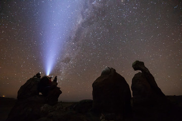 Wall Mural - the amazing night skies at atacama desert, here in the coast area with the virgin rock formation and
