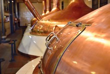 View Of Beer Brewery Interior With Traditional Fermenting Copper Vats.