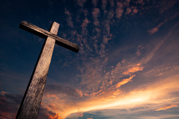 Wall Mural - The cross of salvation in a beautiful sunset