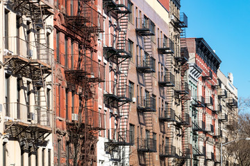 Fototapete - Repeating pattern of fire escapes on colorful old buildings along St. Marks Place in New York City