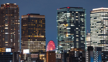 Canvas Print - Modern office buildings at night in Osaka city, Japan