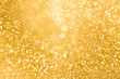 Gold glitter sparkle glam background texture for golden Christmas sparks, wedding anniversary or birthday