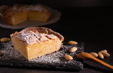 Poster - homemade almond frangipane cake in selective lighting